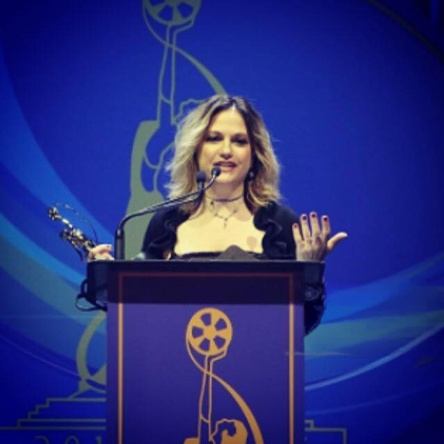 Julia Valente accepting an award